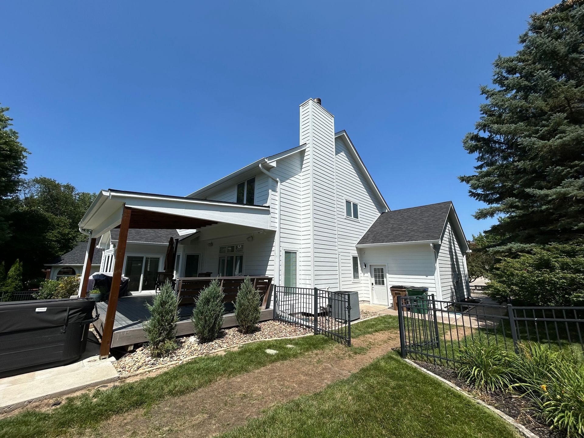 White clapboard siding with a small, white-framed window.