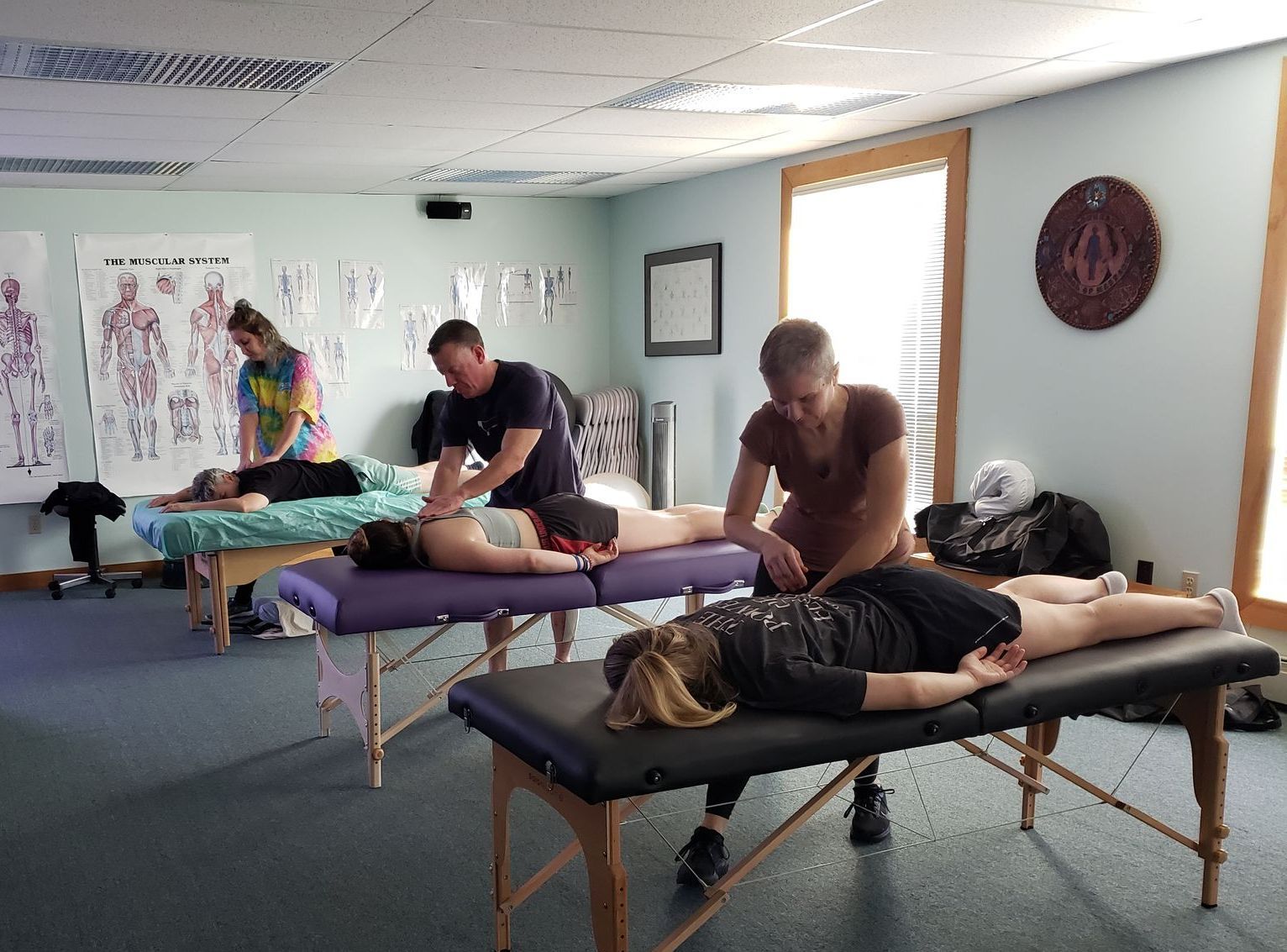 Students — Happy People Massaging a Woman in Waldoboro, ME