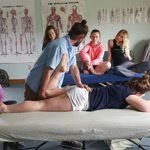 Licensed — Man Demonstrating Back Massage to Students in Waldoboro, ME