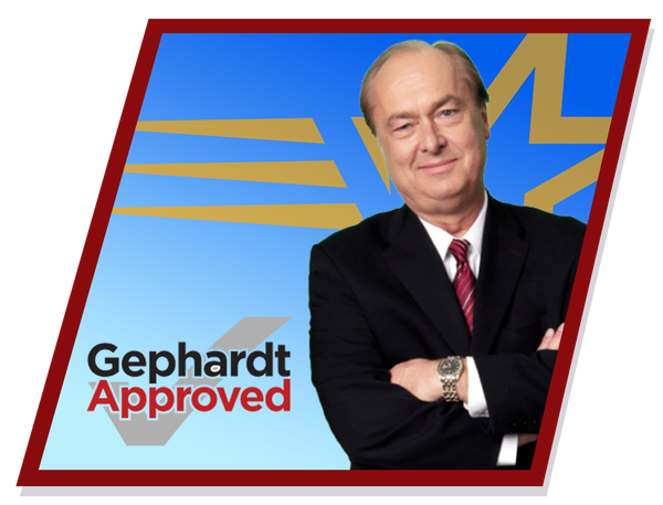 Gephardt in suit, arms crossed, smiling, against a blue background with gold star and stripes, Gephardt in suit, arms crossed, smiling, against a blue background with gold star and stripes,