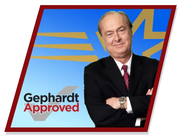 Gephardt in suit, arms crossed, smiling, against a blue background with gold star and stripes, 