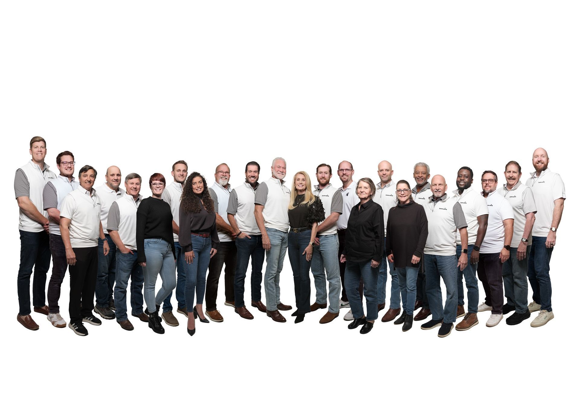 Group of people in white shirts and jeans, posing against a white background.