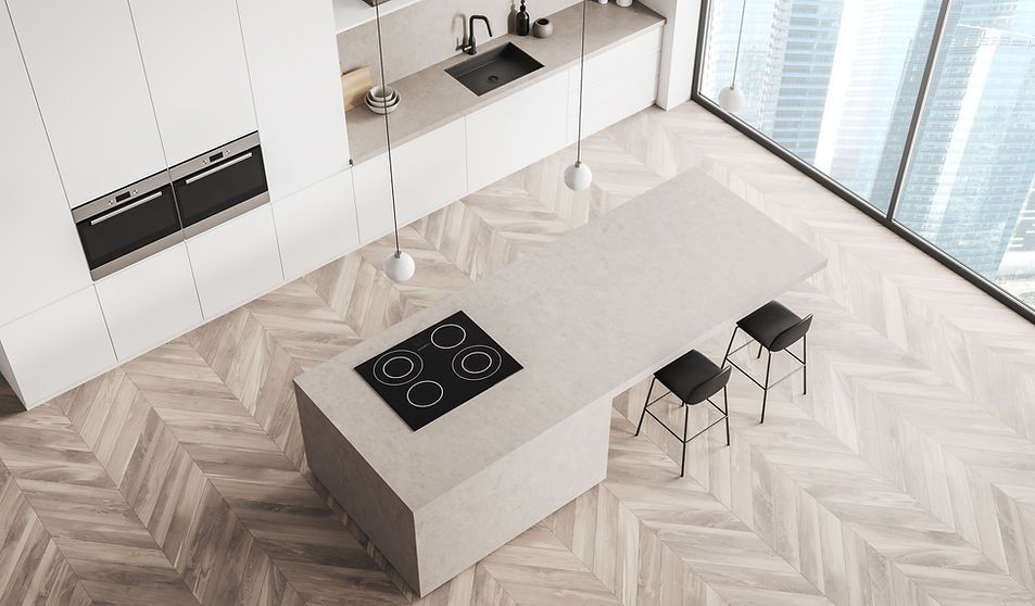 Modern, bright kitchen with island, stove, and stools; light wood flooring, tall windows.