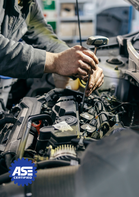 A mechanic repairing a car  | Top Gun Auto Repair