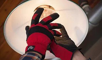 man fixing a lightbulb