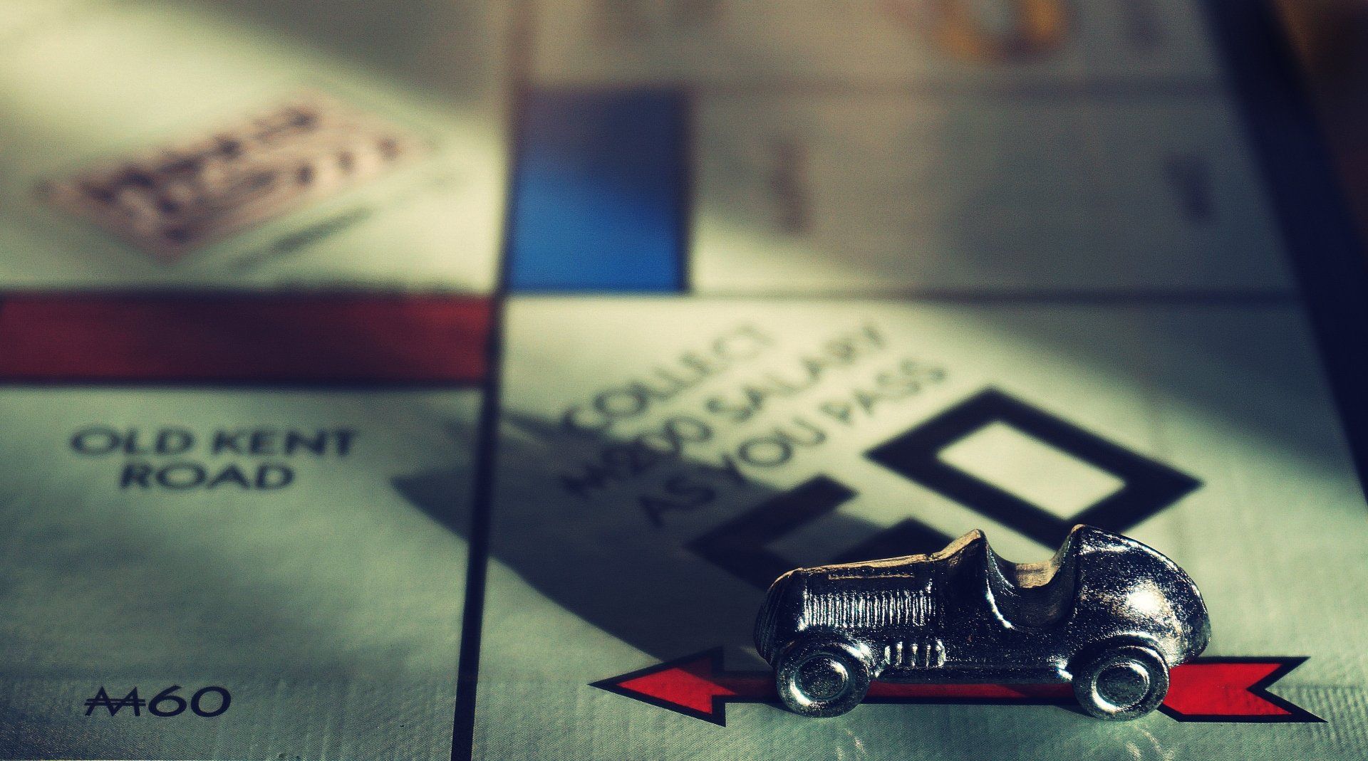 Monopoly board with car token on 