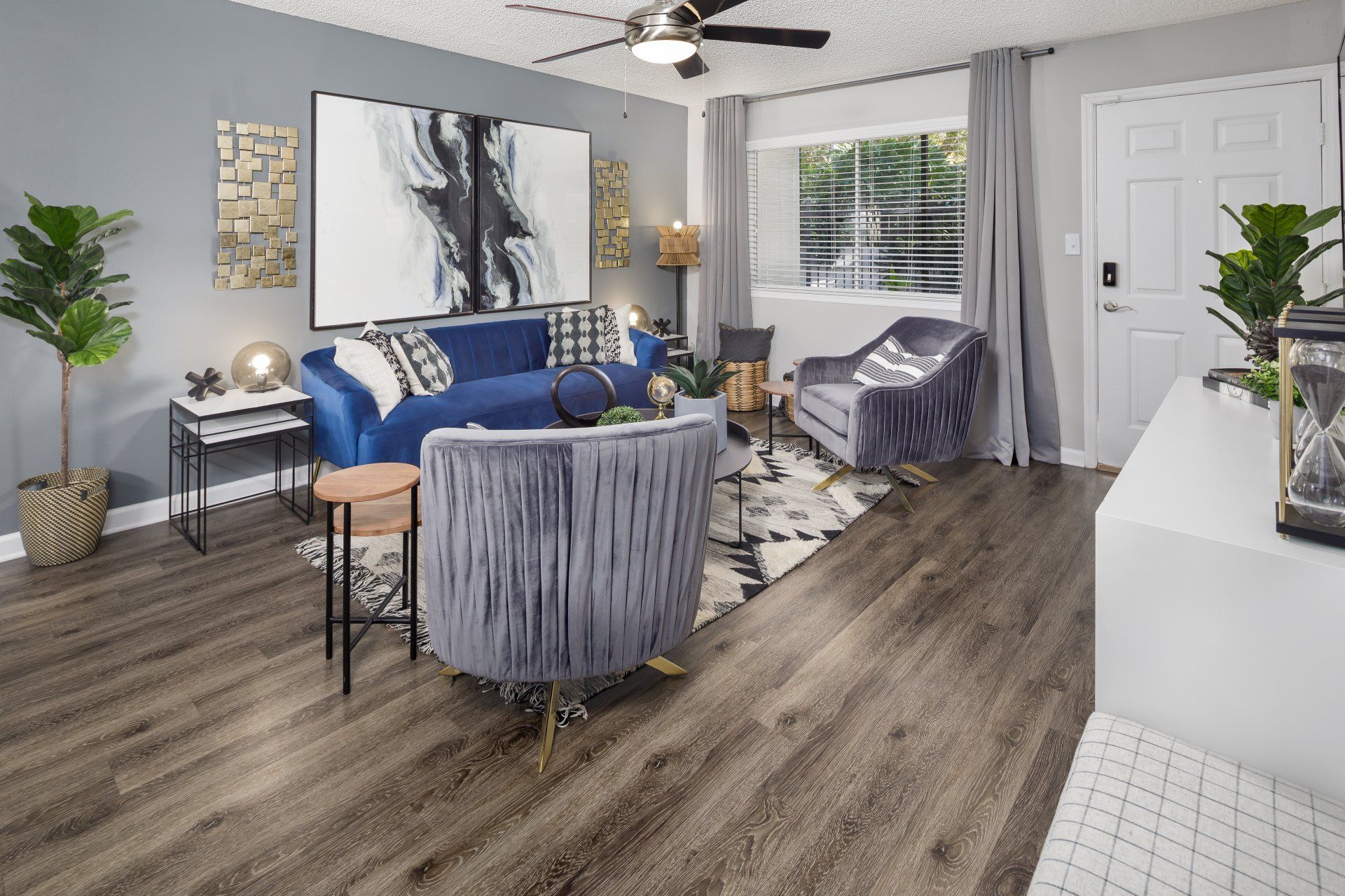 Spacious Living Room with window, sofa, and ceiling fan at 1801 Metrowest