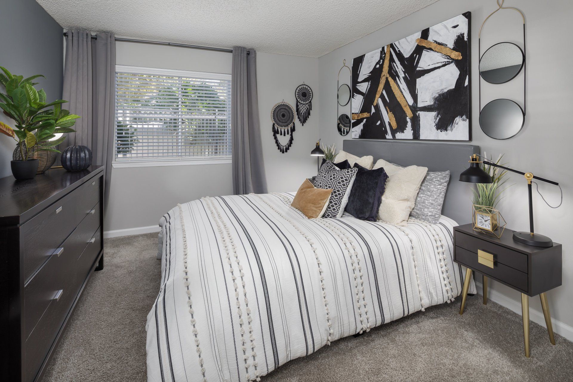 Bedroom with wall art at 1801 Metrowest.
