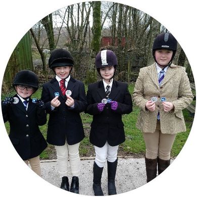 children ready for horse riding lessons