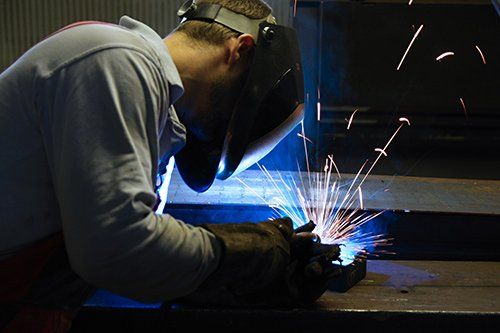 Basic Machining's certified, precision welder.