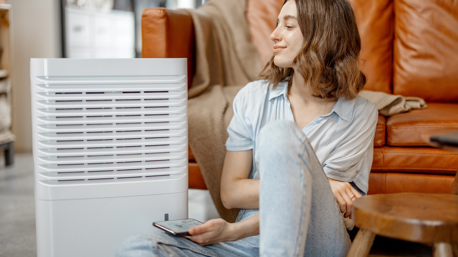 Woman sitting next to air purifier