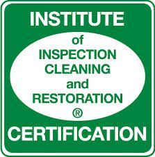 Green sign with white text and oval: Institute of Inspection Cleaning and Restoration Certification.
