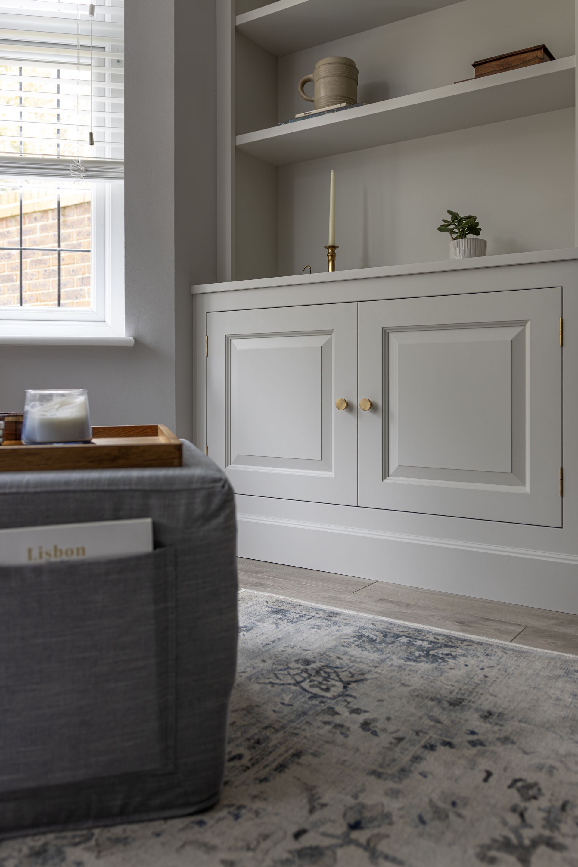 a living room with a built in display units