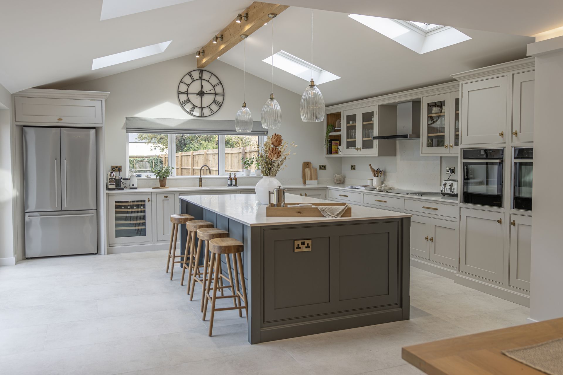 a kitchen with wooden cabinets and a large island