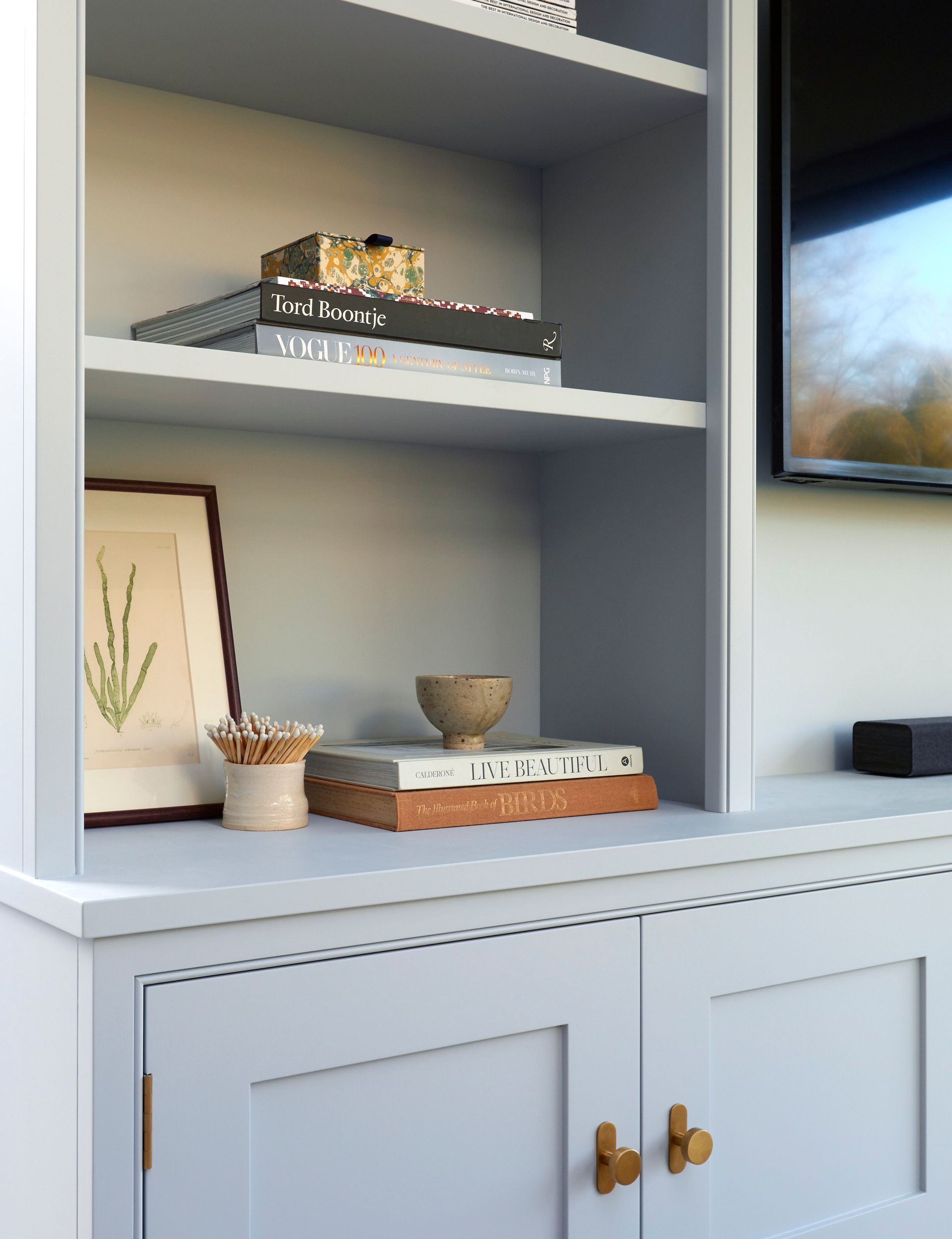 a bespoke library with books and a picture on it