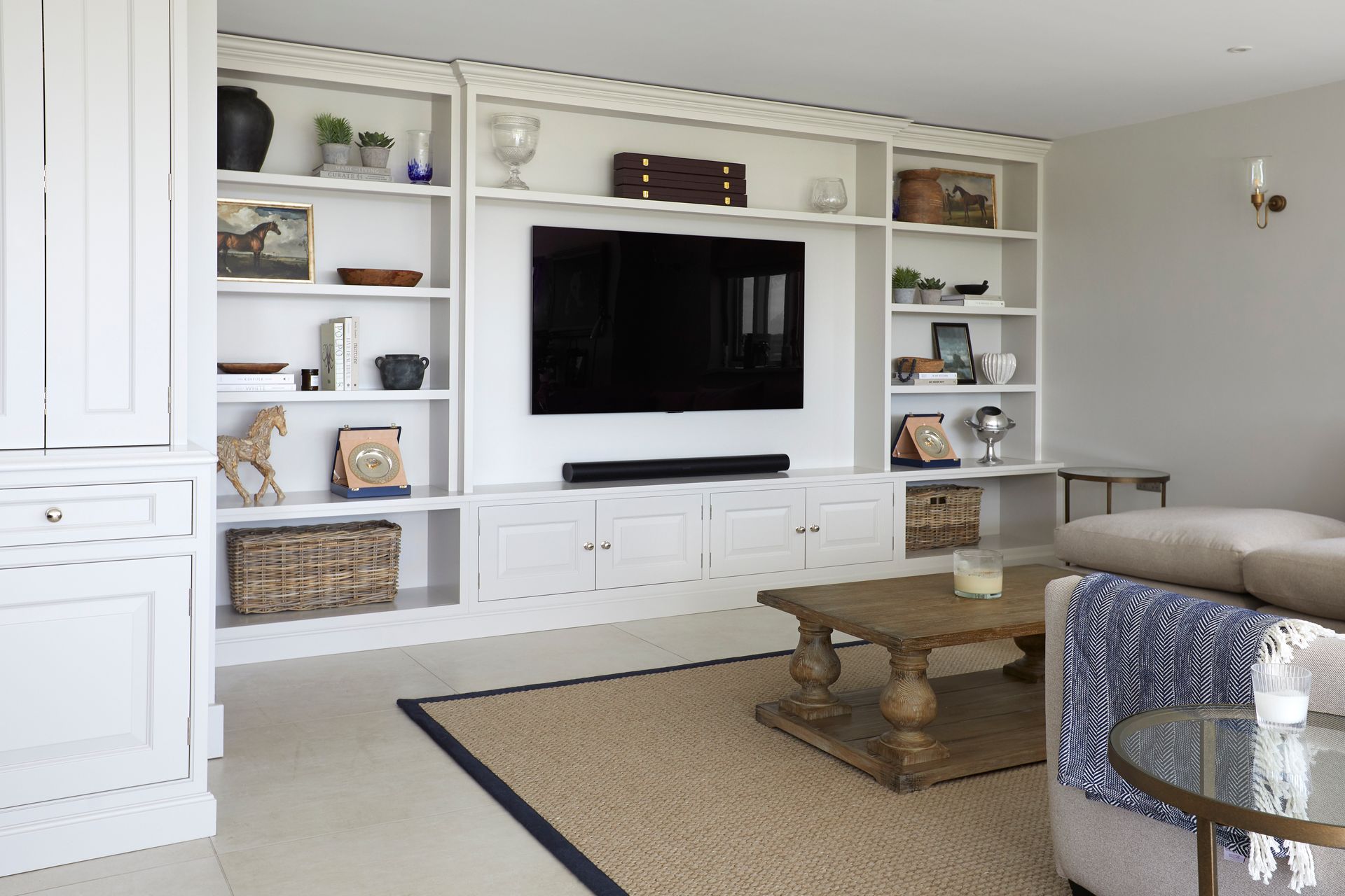 a living room with a built in media wall units