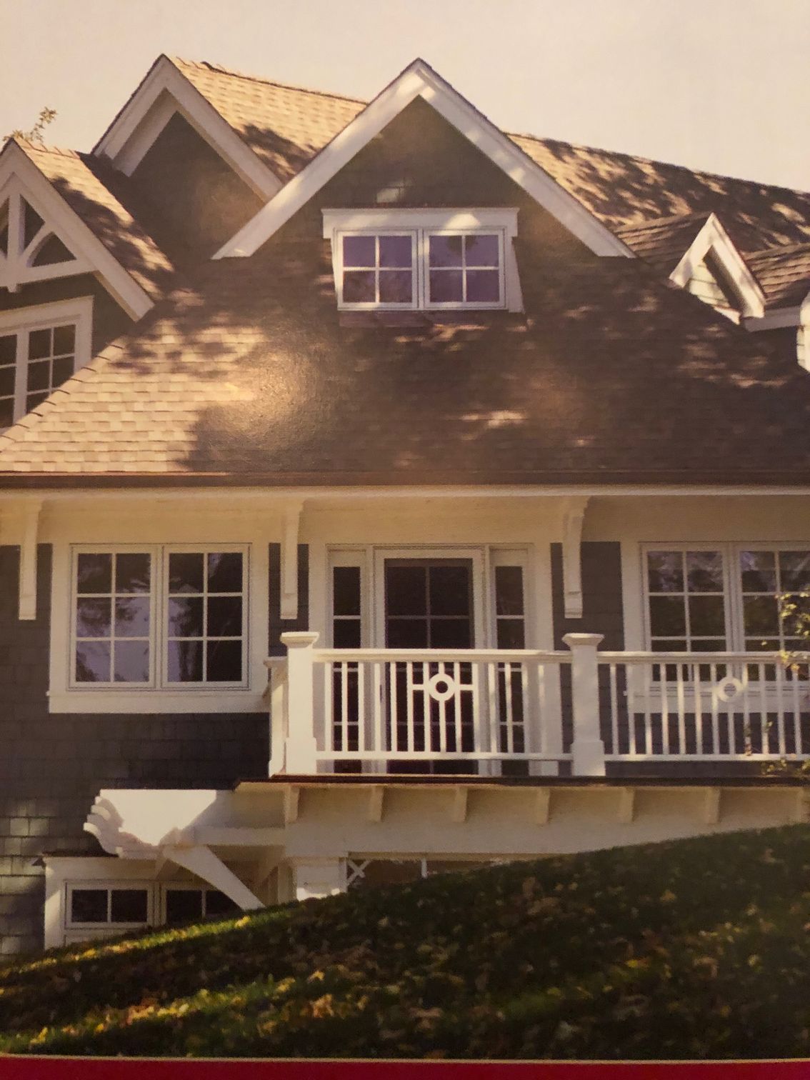 A picture of a house with a white railing