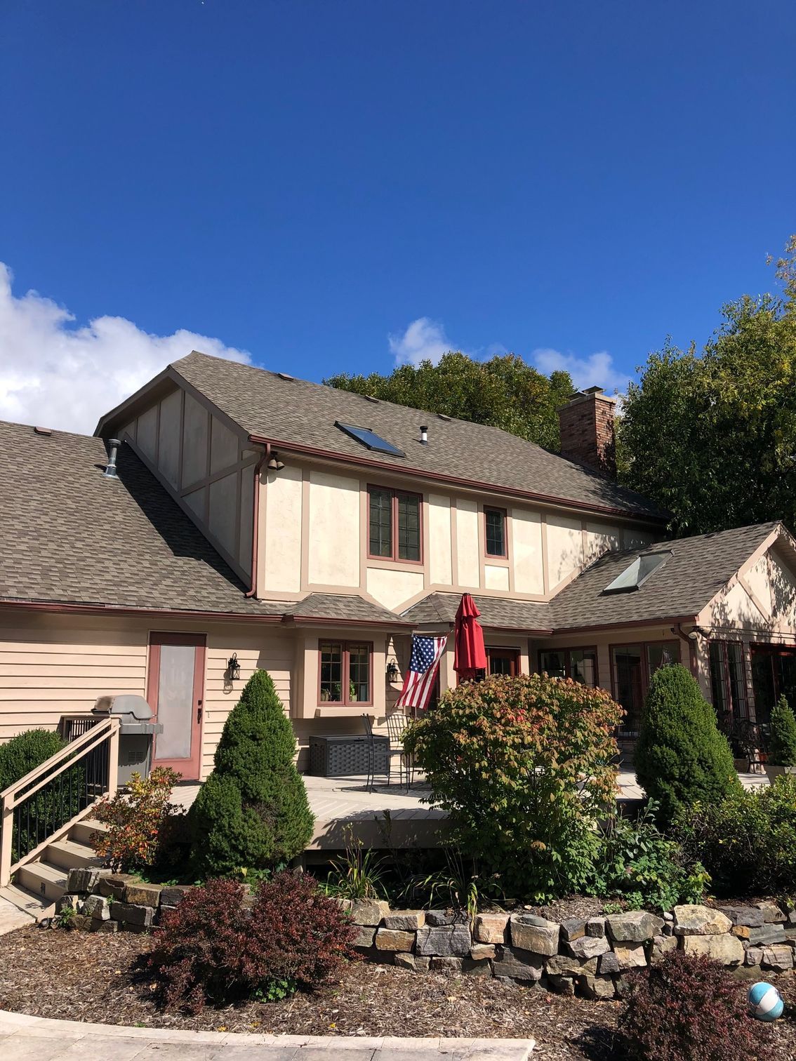 A large house with a roof that has a solar panel on it.