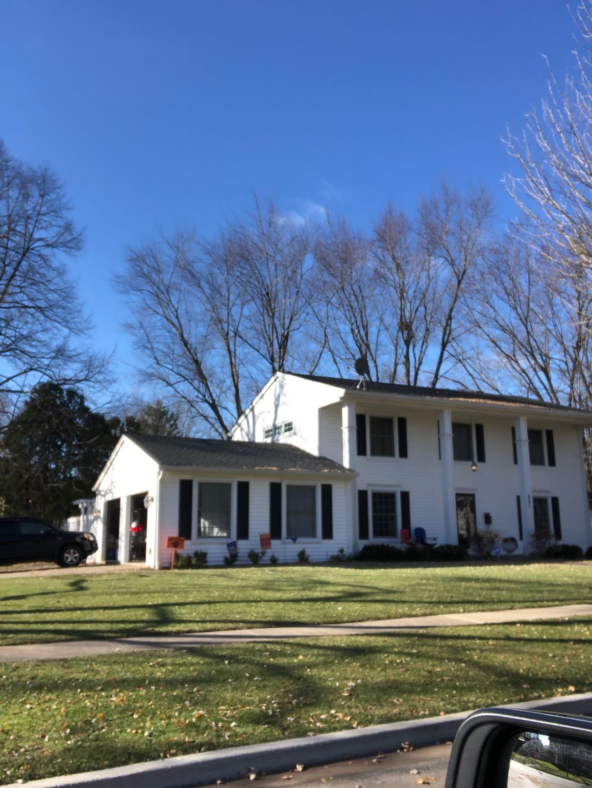A white house with a blue sky in the background