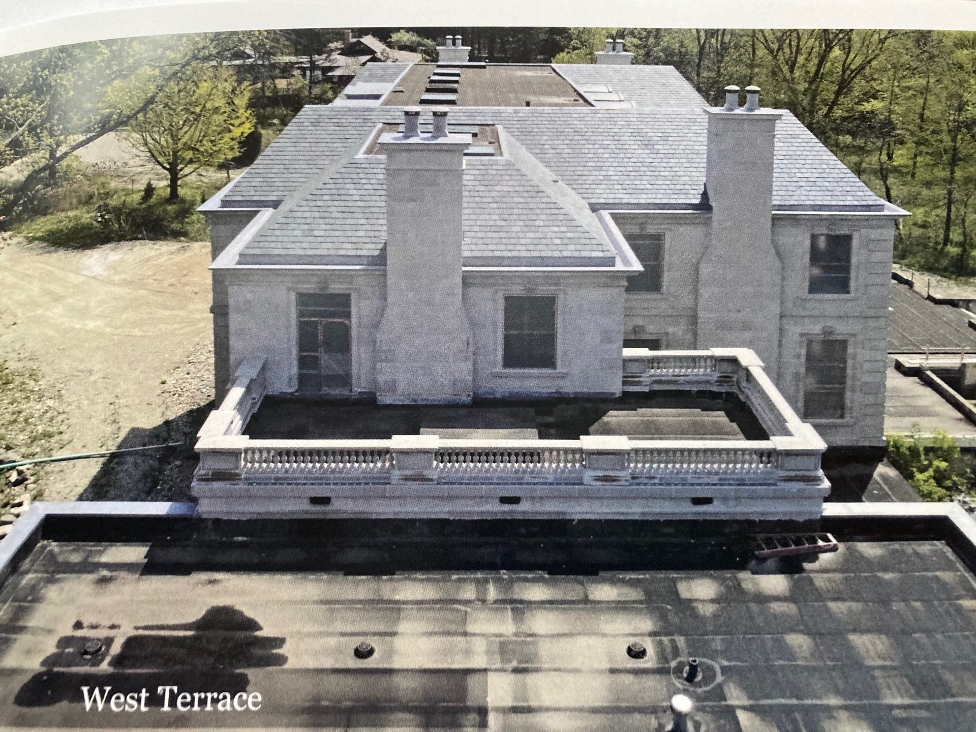 An aerial view of the west terrace of a large house
