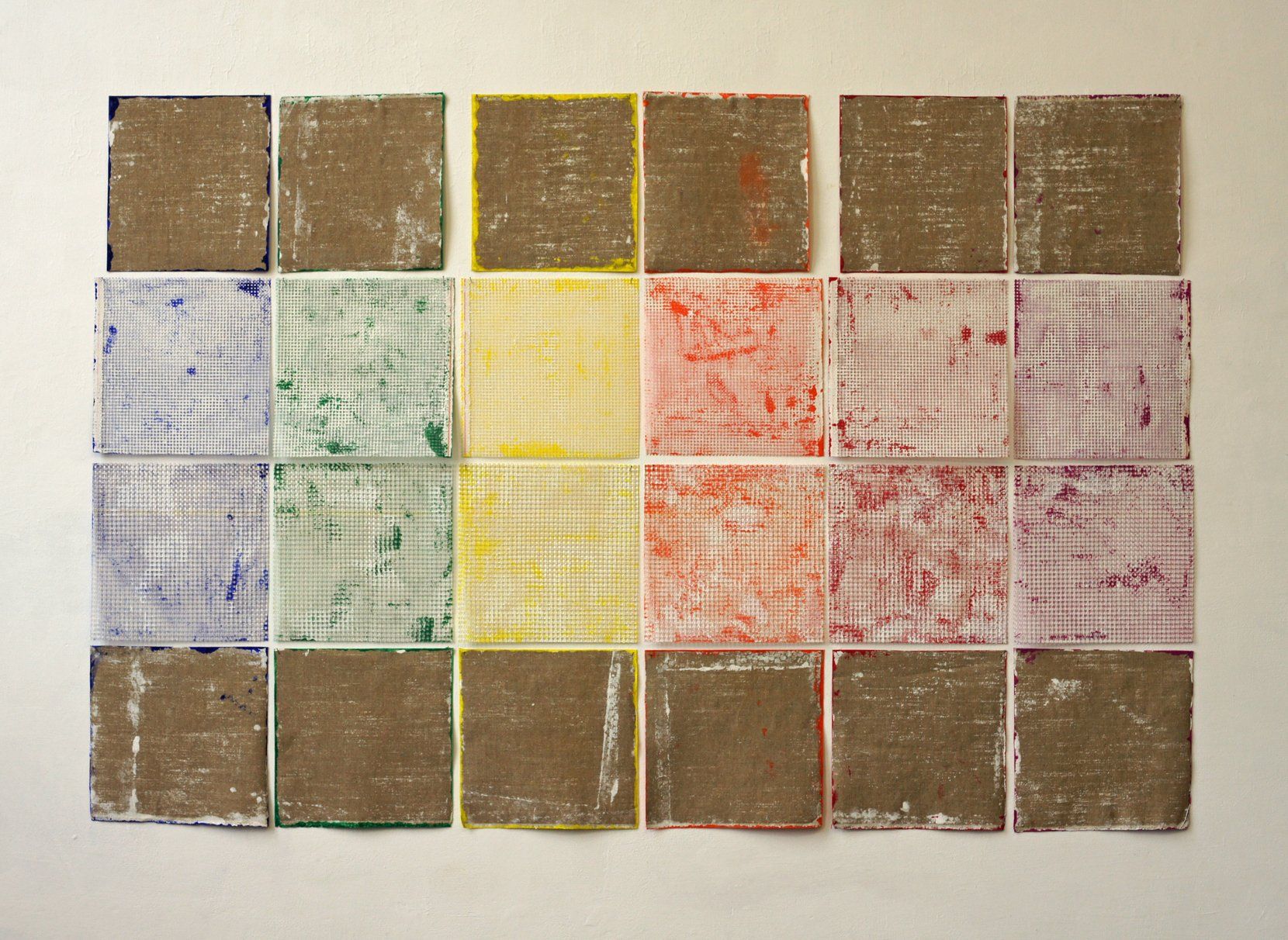 a fundamental painting consisting of 24 pieces grit and linen, painted on the backside.