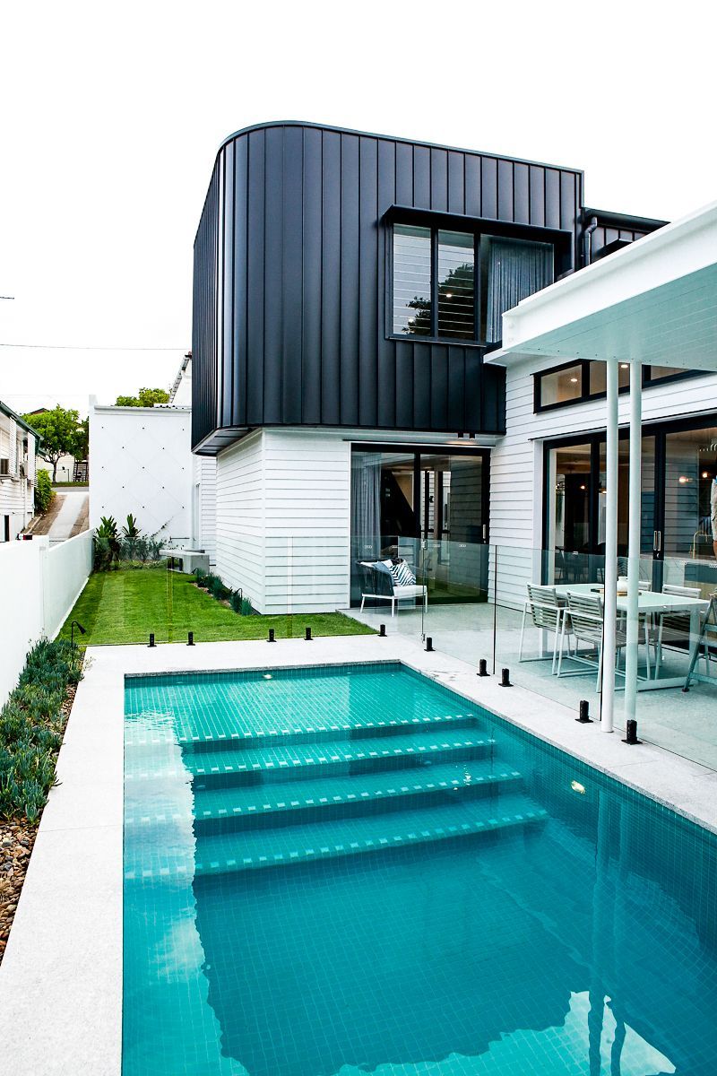 Modern pool area with tiled surround and glass fencing – Ascot tiling work