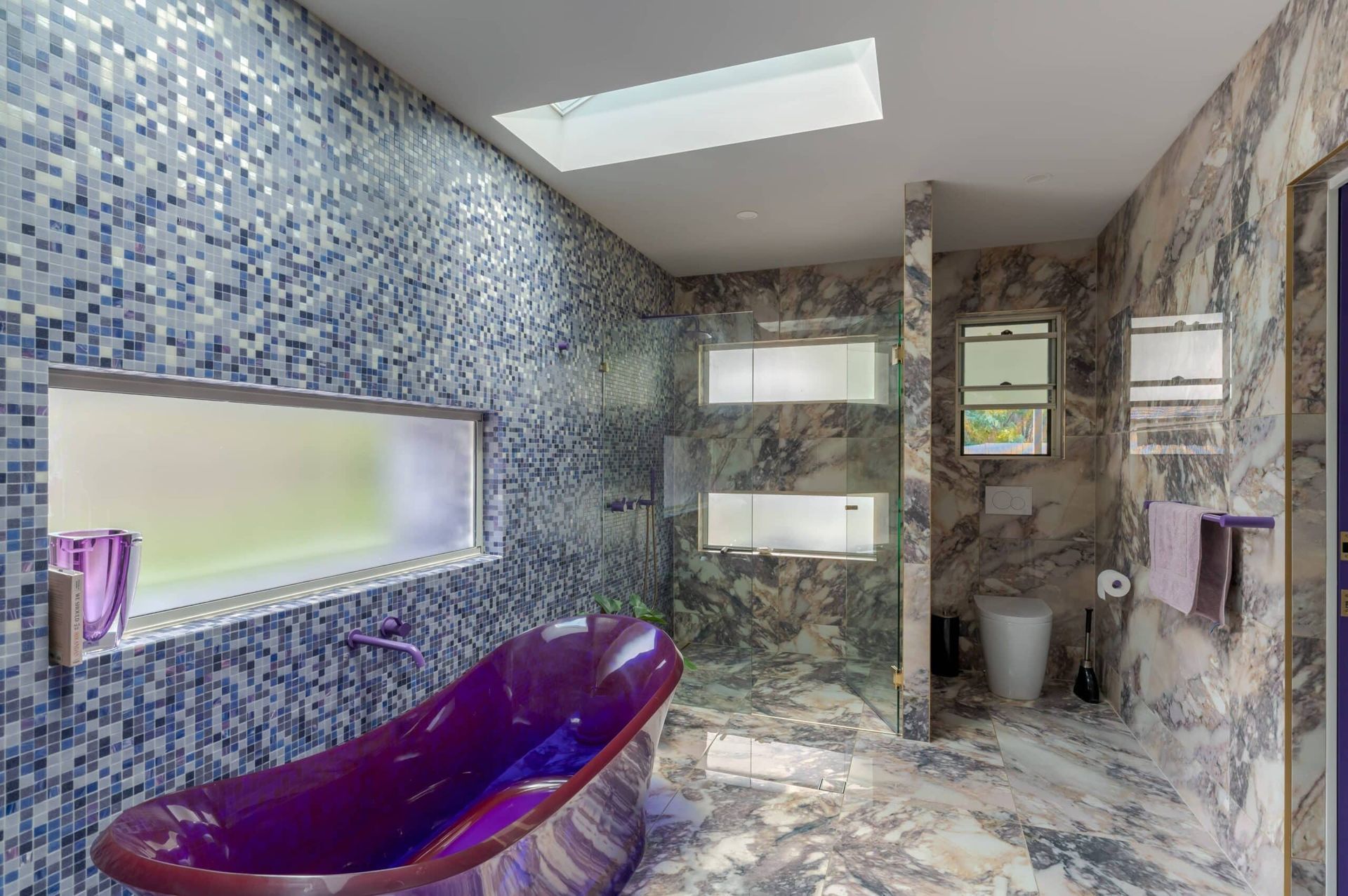 Blue mosaic shower and bath area with skylight – Samford project