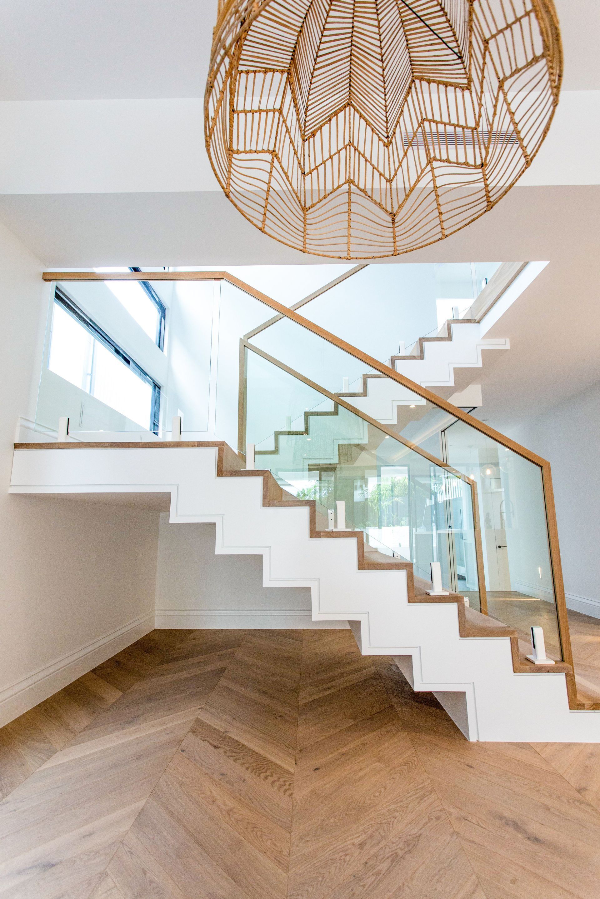 Staircase with tiled steps and glass balustrade – Camp Hill project