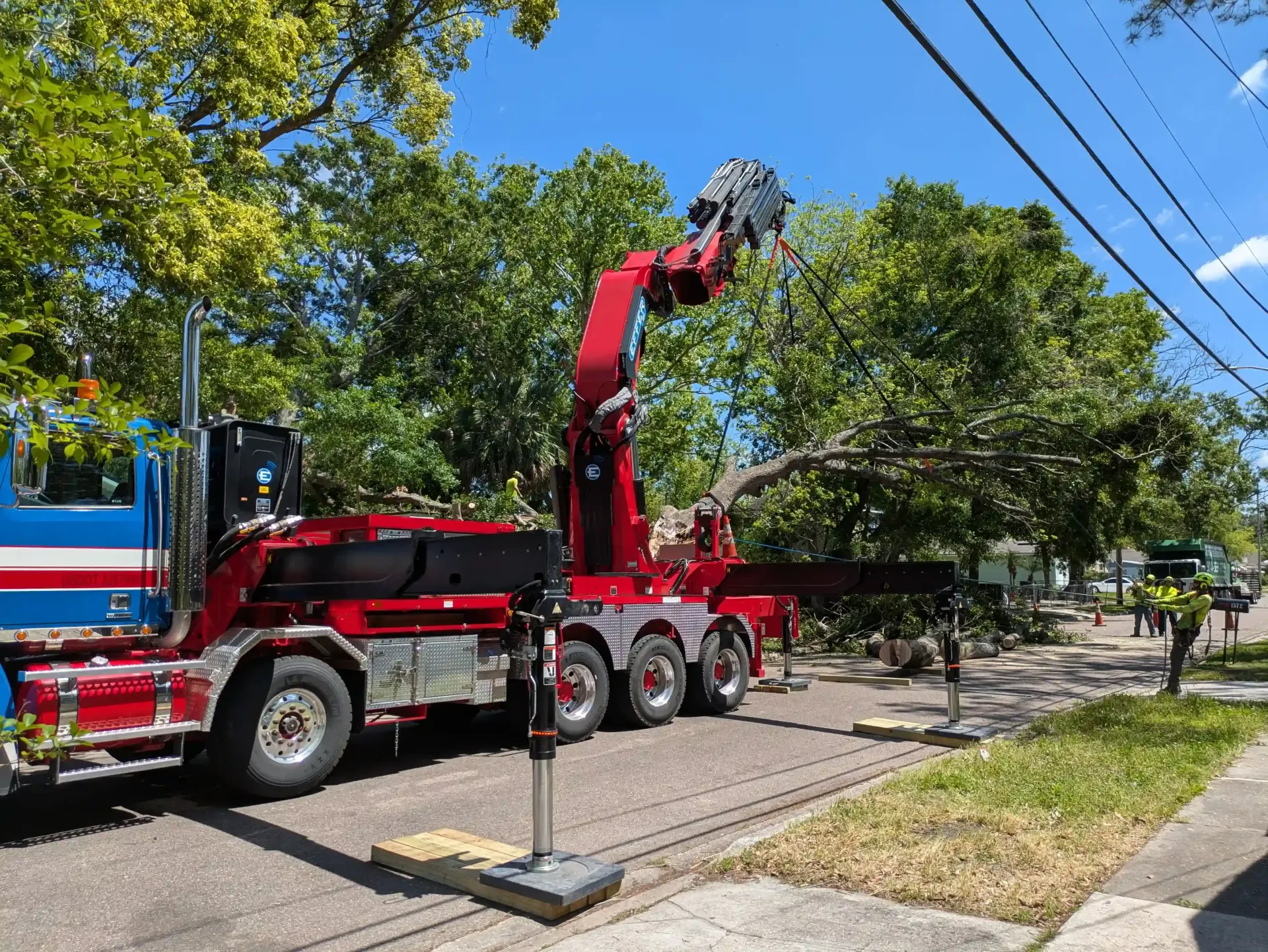 Emergency storm clean up crane assisted tree removal Jacksonville FL
