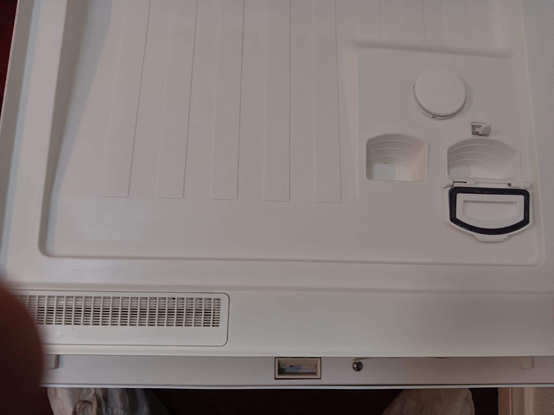 The inside of a white refrigerator with the door open