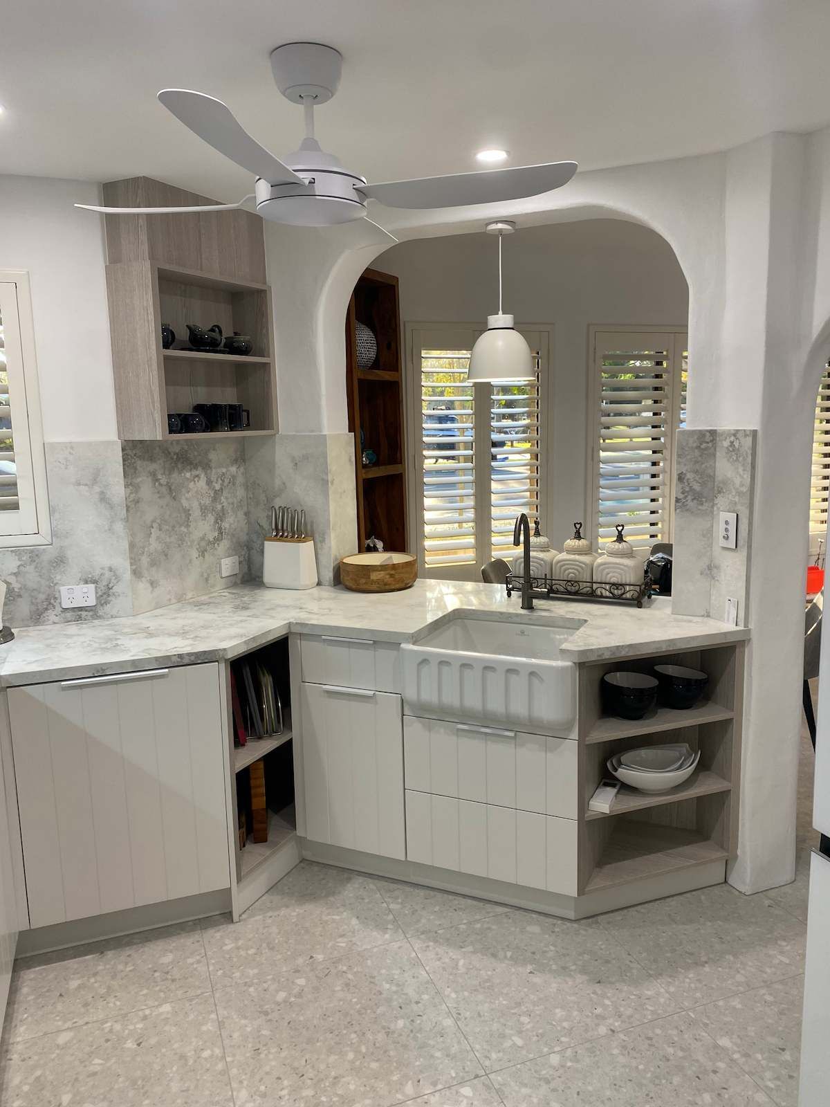 Kitchen With White Cabinets and Grey Marble Countertops — Nick Hall Builder in Cooroy, QLD