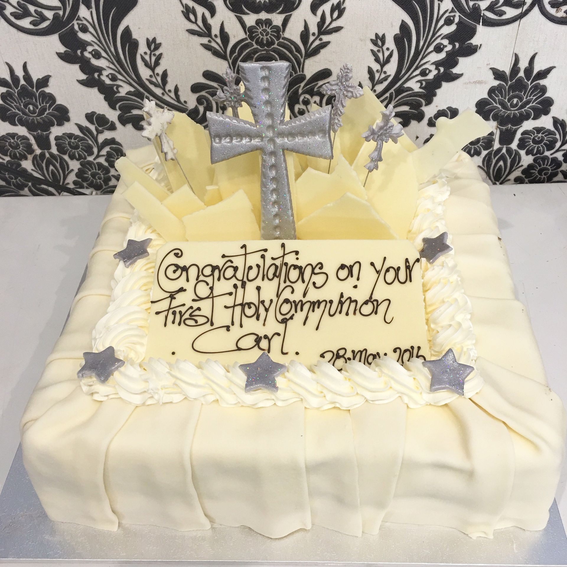 white holy communion cake with silver cross