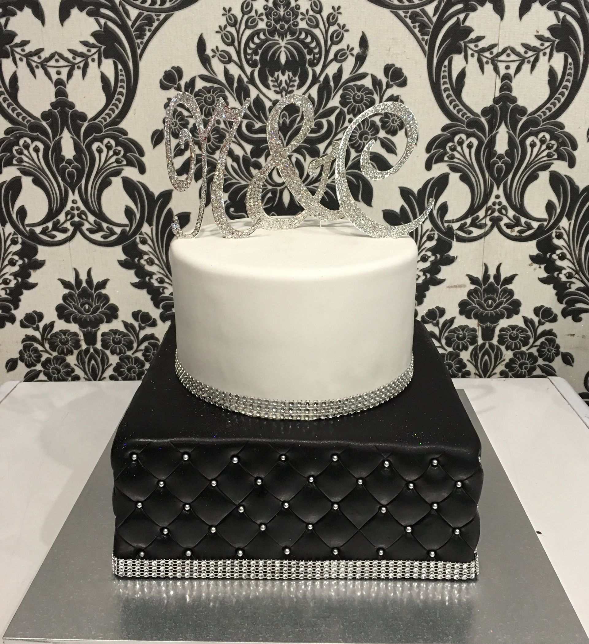 pink pillow effect double cake with black detail