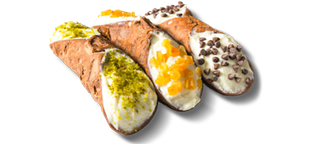 Three cannolis with different fillings