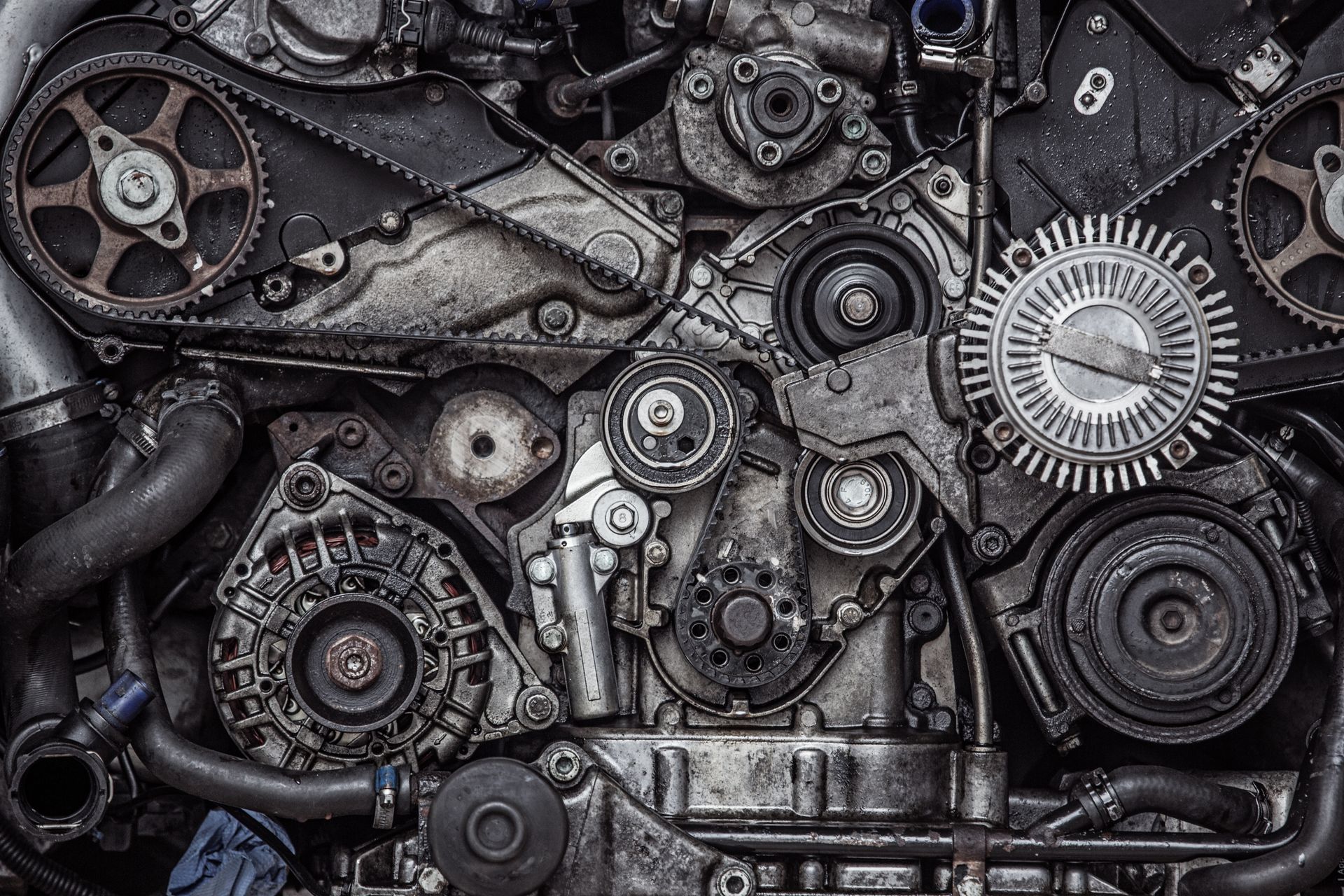 A close up of a car engine with a lot of gears.