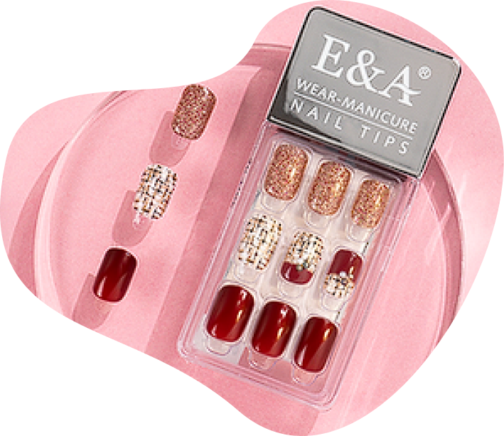 Uma caixa de pontas de unhas e & a wear-manicure em uma superfície rosa.