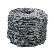 Bobina de alambre de púas, forma cilíndrica, metal gris plateado.