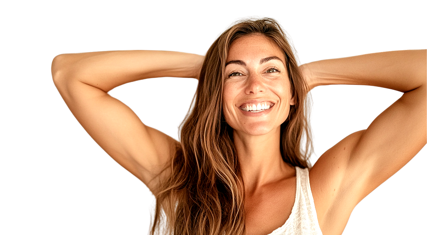 A woman is smiling with her hands behind her head.