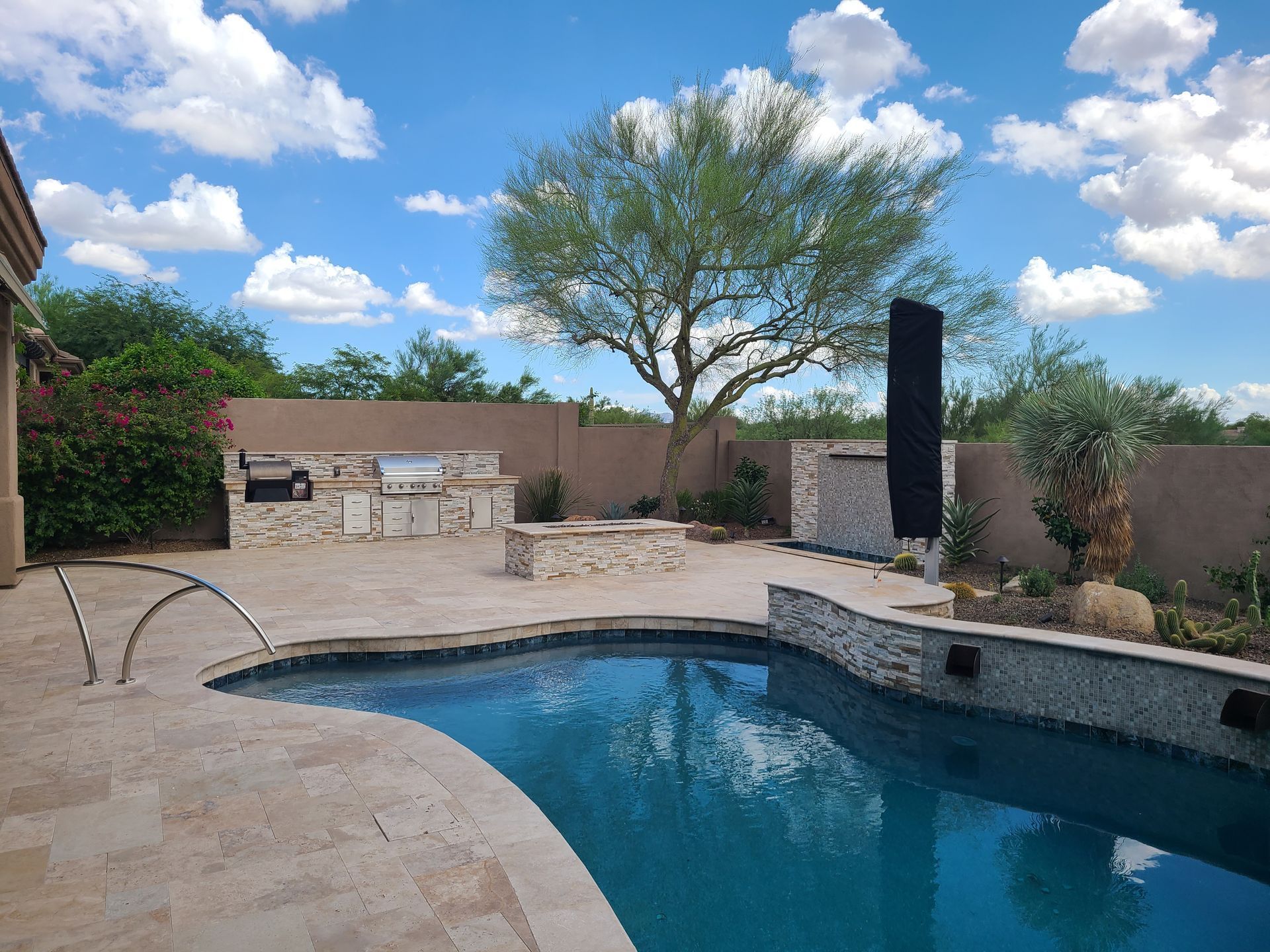 A large swimming pool in the backyard of a house