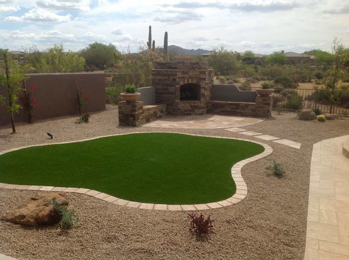 A backyard with a swimming pool and a fireplace.