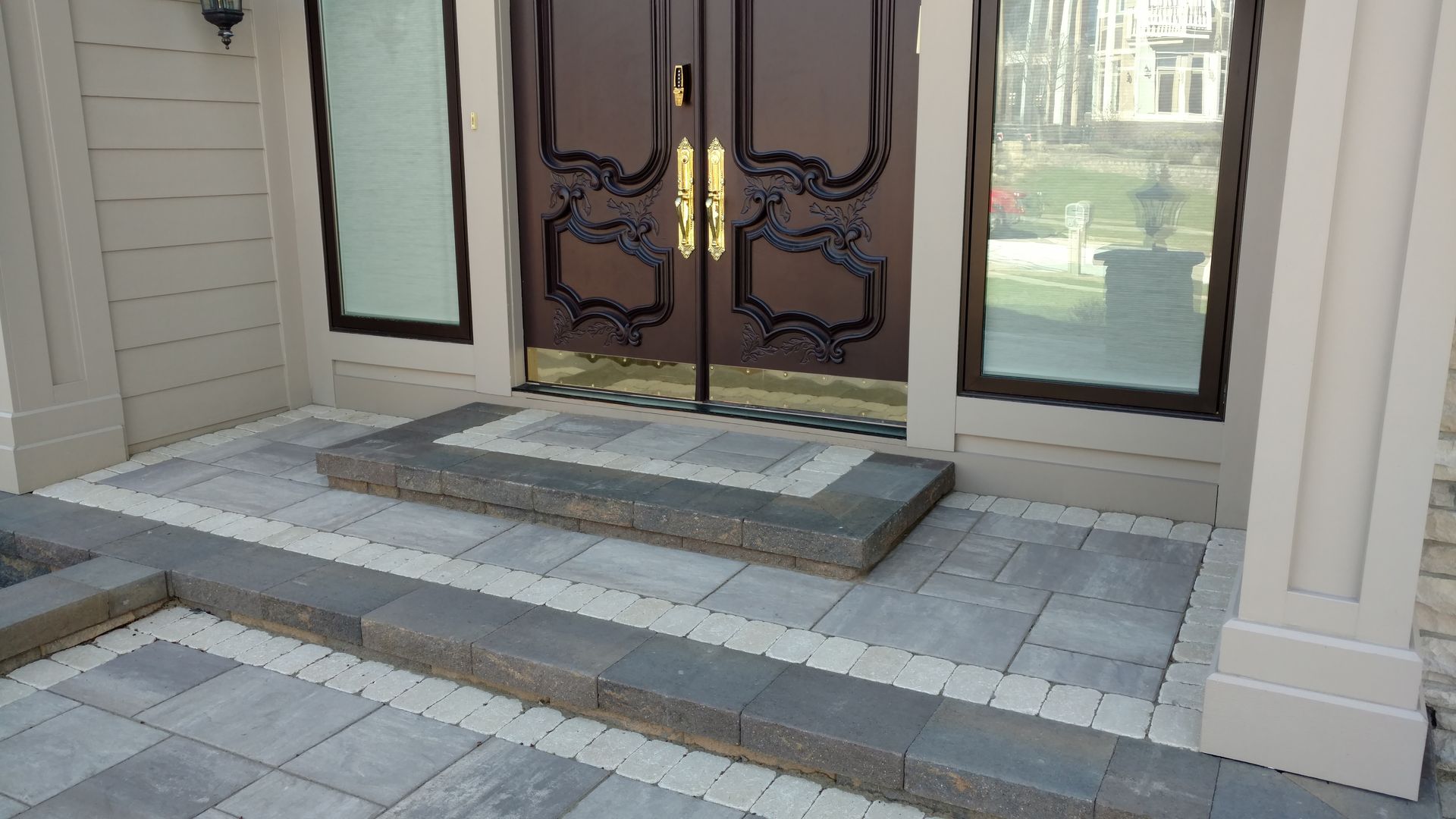 The front door of a house with steps leading up to it.