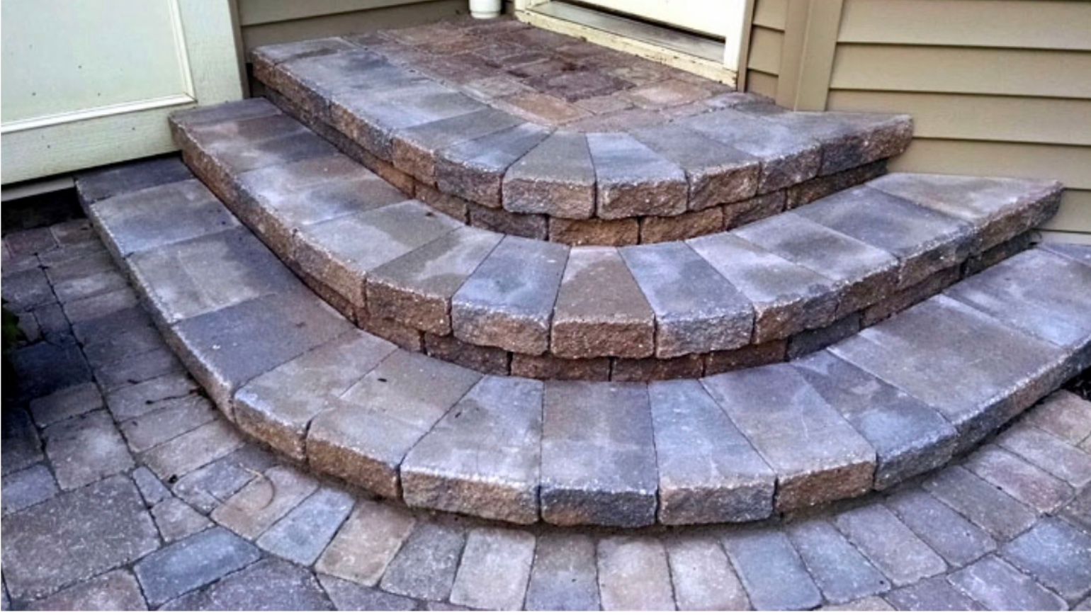 A set of brick steps leading up to a house.