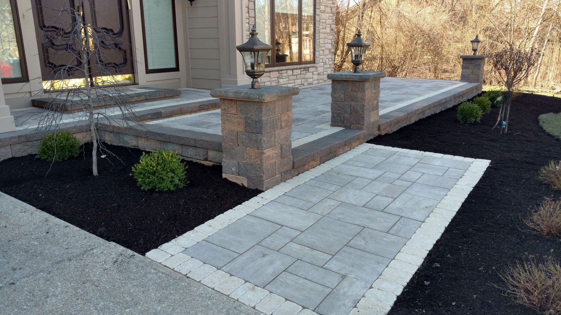 A walkway leading to the front door of a house.