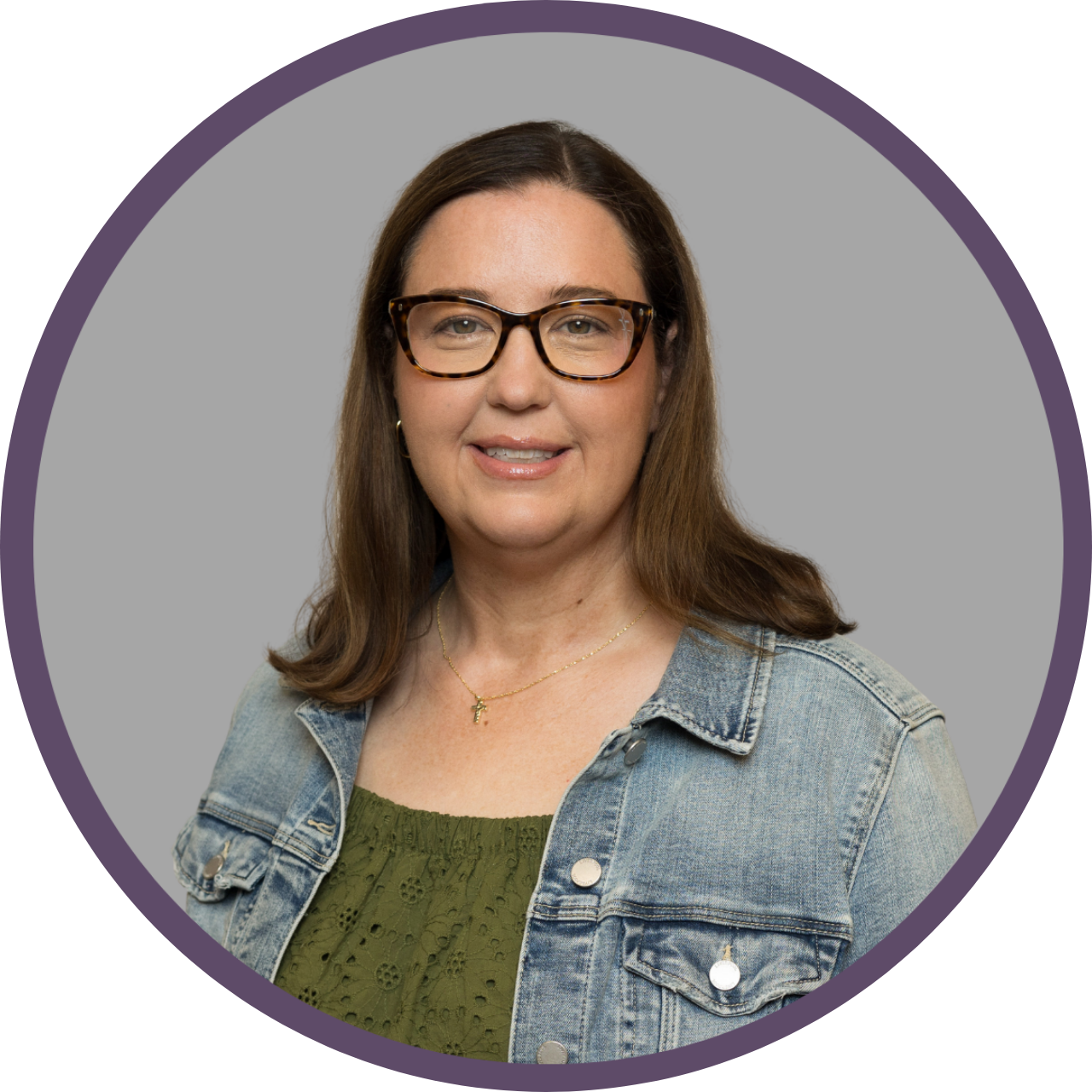 Silhouette of a person with curly hair, shoulders, and upper chest, in shades of gray.
