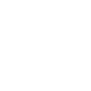 Two people sitting at a table discussing a document