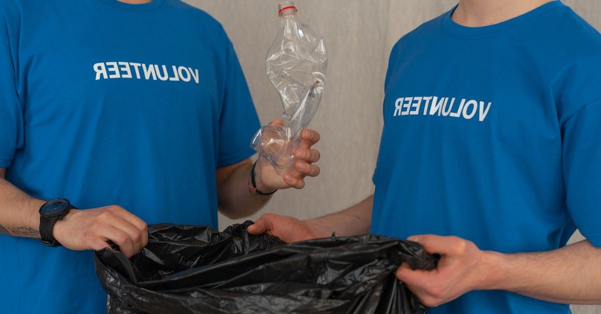 Two people wearing blue shirts with the word 