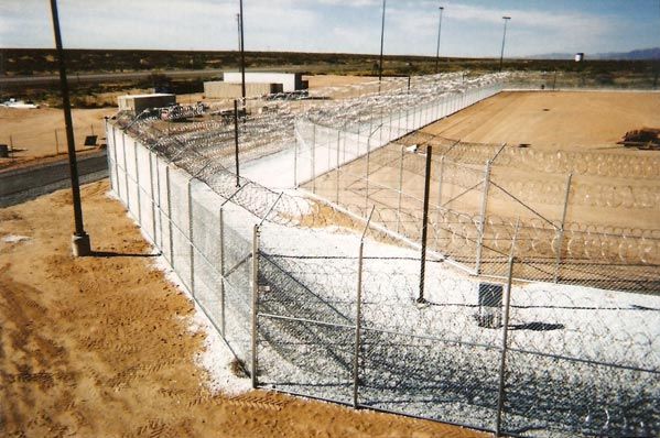 Professional Fence Installation — Large Pathway with High Fence in Albuquerque, NM