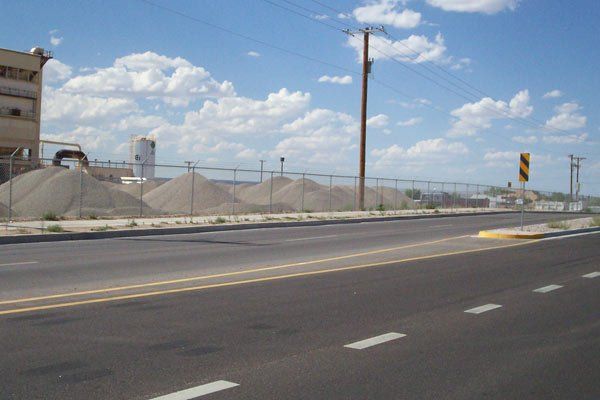 Expert Fence Installation Company — Chain Fence on the Sidewalk in Albuquerque, NM