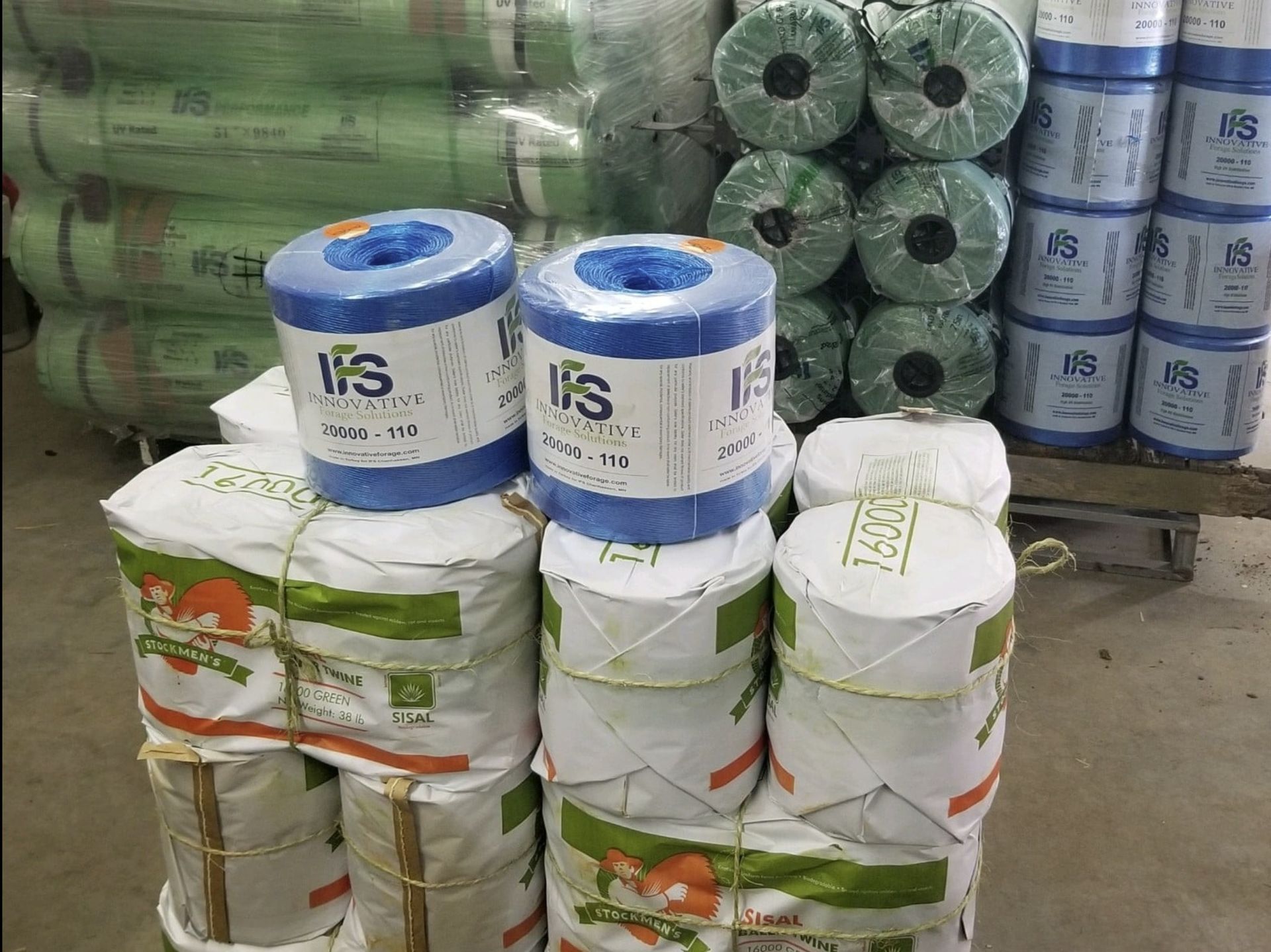 A bunch of rolls of paper towels are stacked on top of each other.