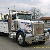 Large white tow truck